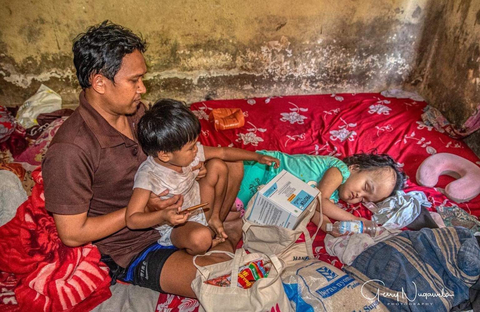 Volunteer hugging child